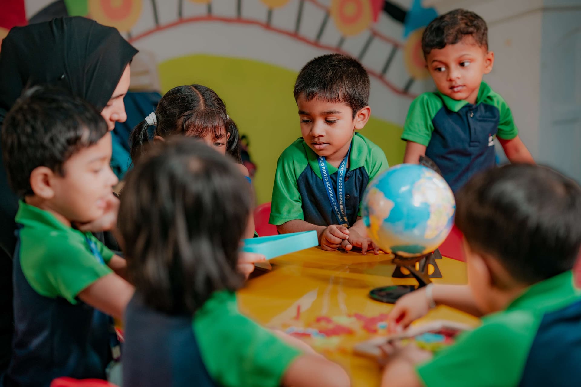 Teacher guiding students in an interactive classroom activity