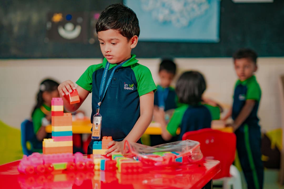 Child building with colorful blocks